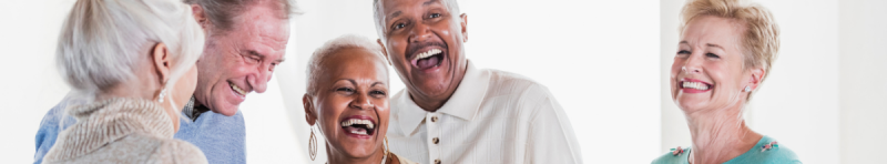 Five older adults talking and laughing