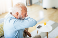 Older man coughing