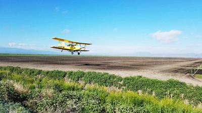 Crop Dusting on a field in Eastern Siskiyou County