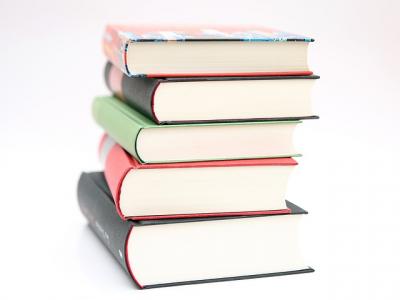 A stack of five books on a white background