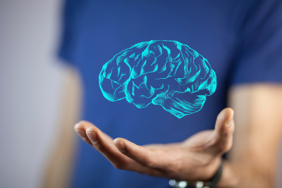 drawing of a brain floating above a hand