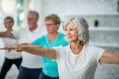 Four adults doing tai chi