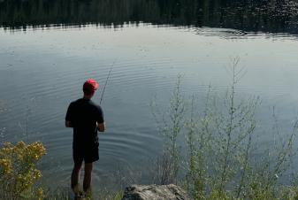 Man Fishing at pond
